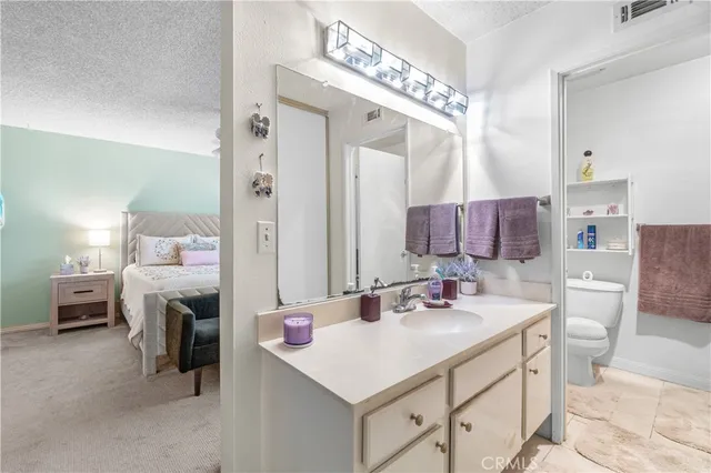 a bathroom with a sink vanity and a mirror
