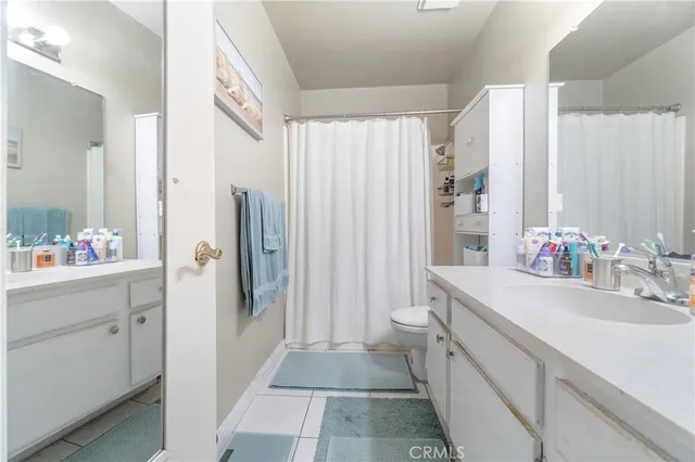 a bathroom with a sink double vanity and a mirror