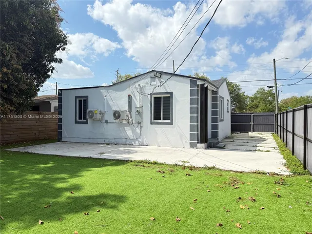 a front view of a house with a yard garage and outdoor seating