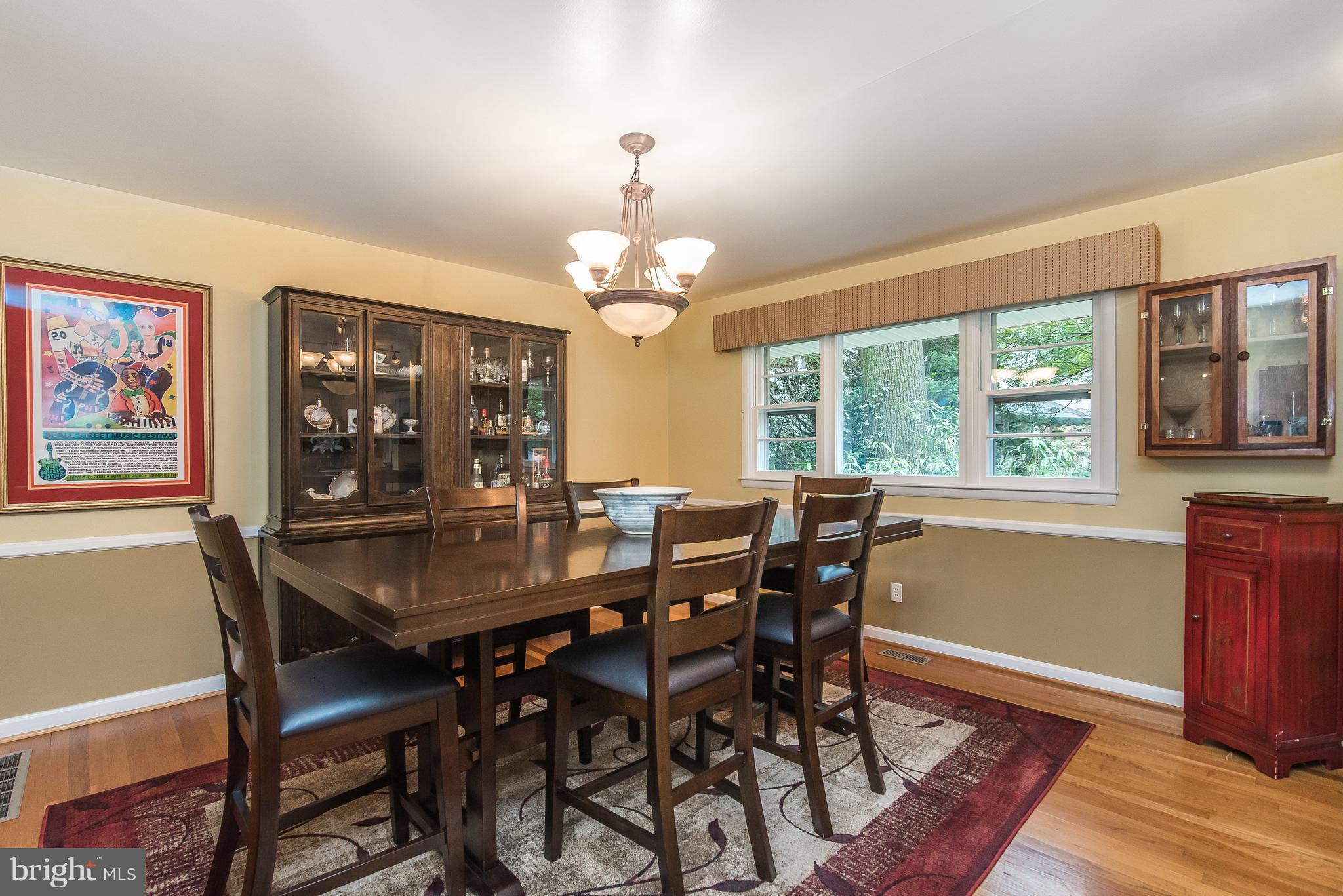 6116 Haddon Hall Road Baltimore, MD 21212 - Photo 13 of 44 a view of a dining room with furniture window and wooden floor