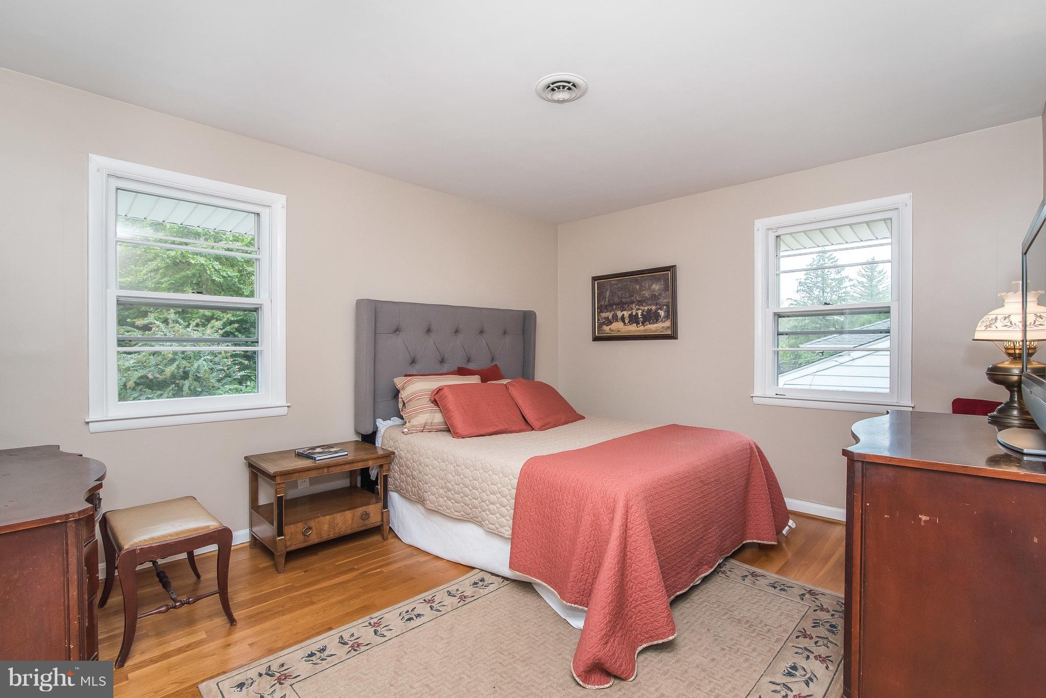 6116 Haddon Hall Road Baltimore, MD 21212 - Photo 19 of 44 a bedroom with a bed and a desk