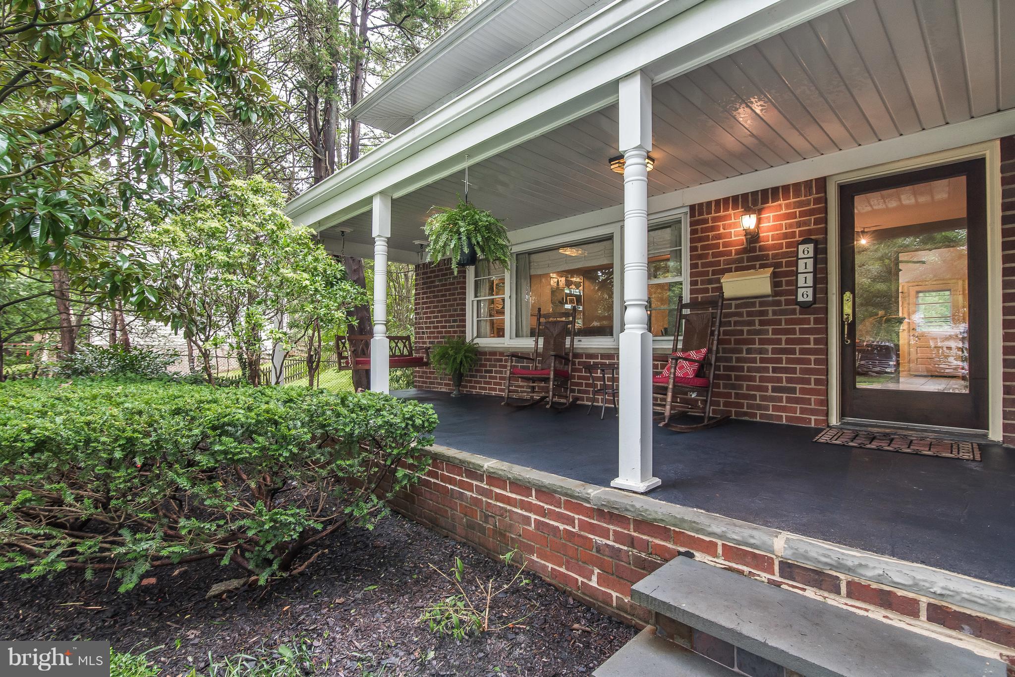 6116 Haddon Hall Road Baltimore, MD 21212 - Photo 3 of 44 a view of a patio with table and chairs and floor to ceiling window