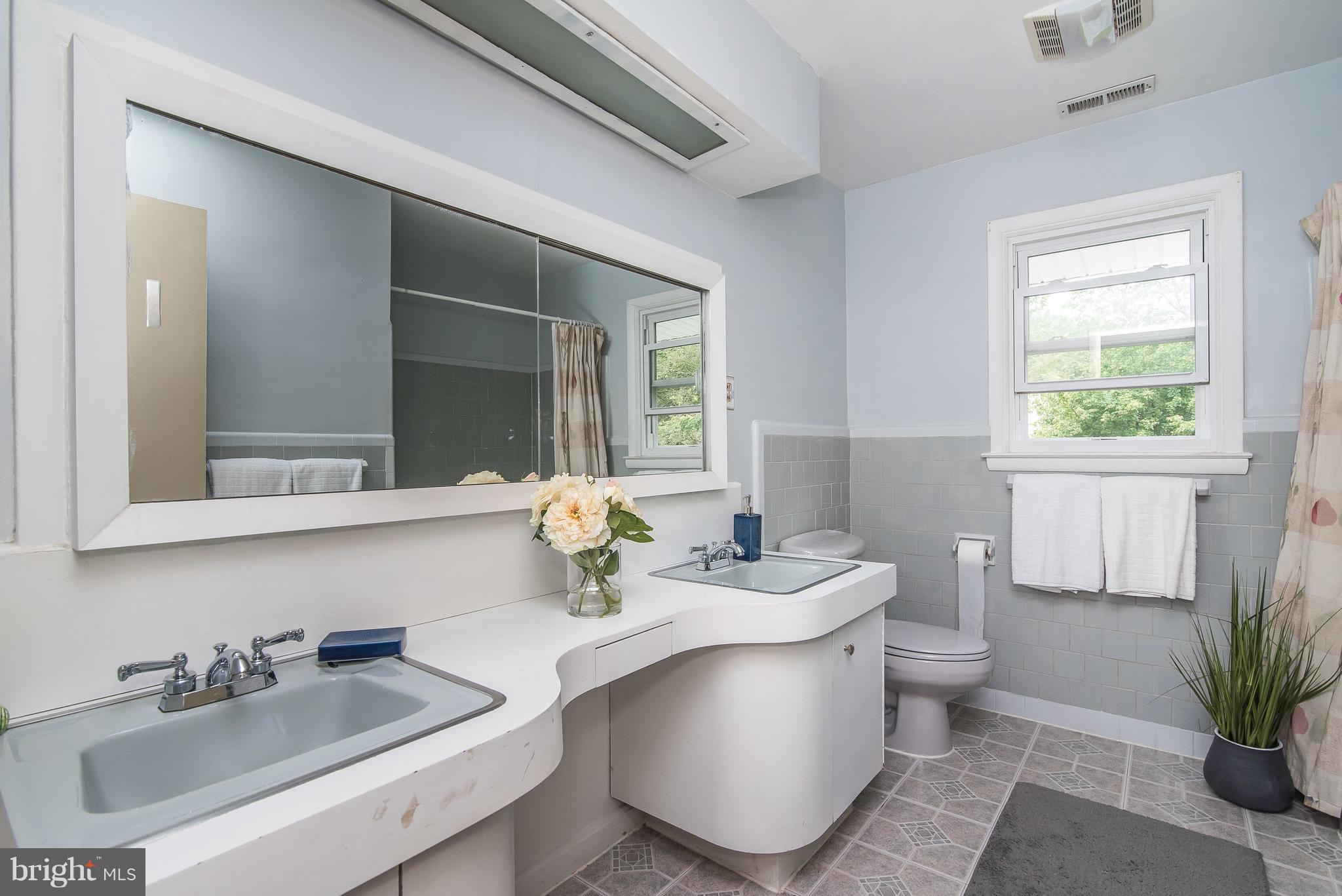 6116 Haddon Hall Road Baltimore, MD 21212 - Photo 20 of 44 a bathroom with a sink and a mirror