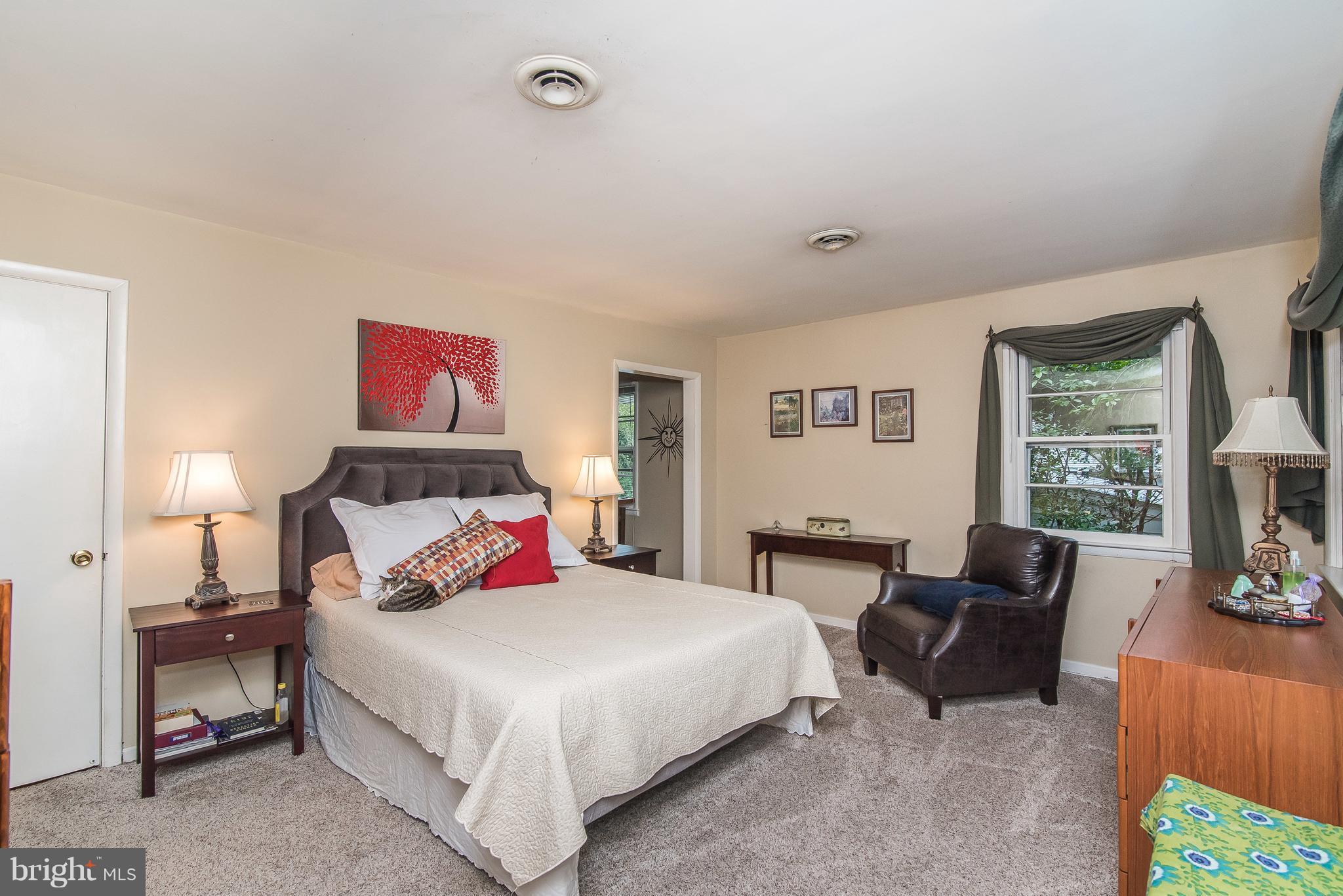 6116 Haddon Hall Road Baltimore, MD 21212 - Photo 23 of 44 a bedroom with a bed and a couch