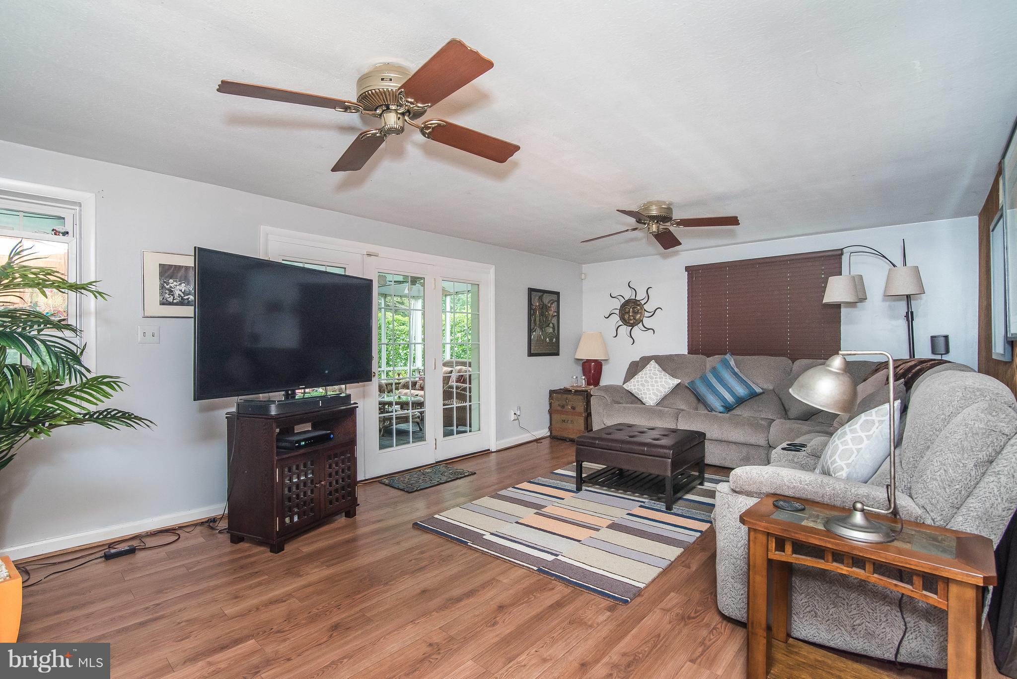 6116 Haddon Hall Road Baltimore, MD 21212 - Photo 29 of 44 a living room with furniture and a flat screen tv