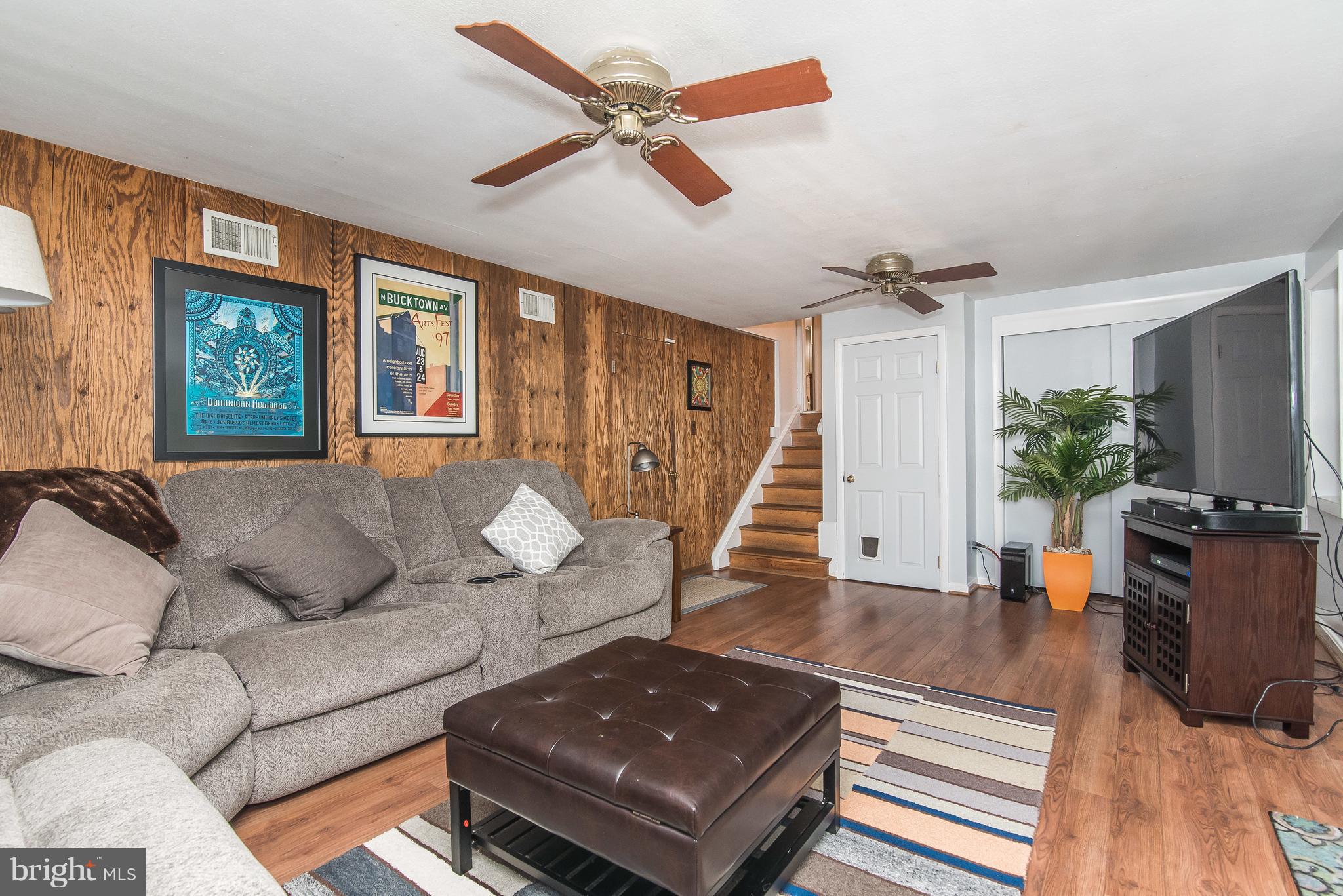 6116 Haddon Hall Road Baltimore, MD 21212 - Photo 30 of 44 a living room with furniture and a flat screen tv
