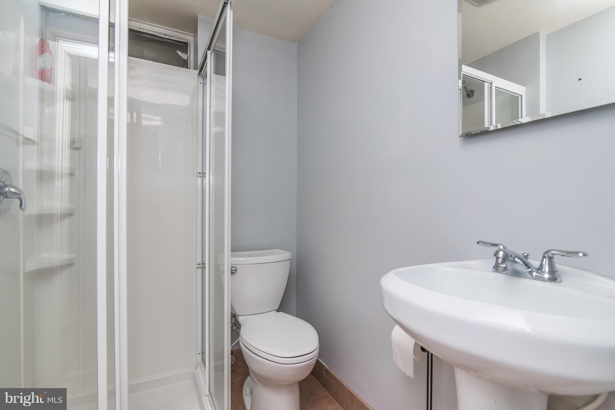 6116 Haddon Hall Road Baltimore, MD 21212 - Photo 32 of 44 a bathroom with a sink and a toilet