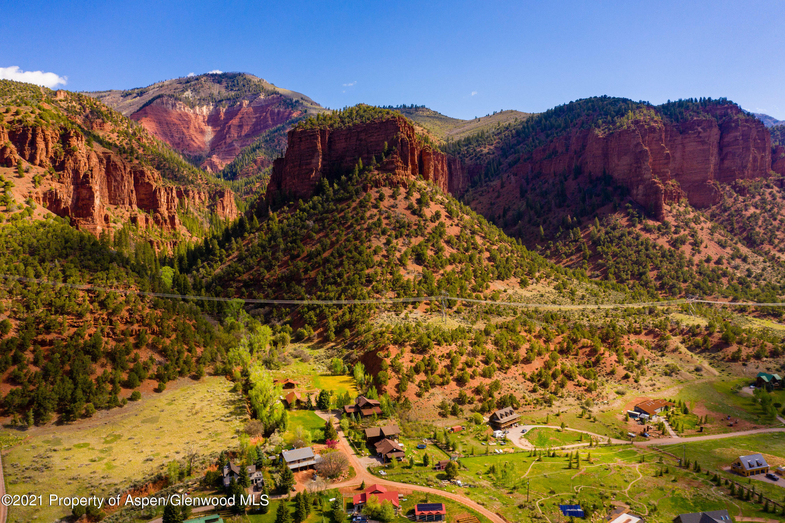 a view of houses with a street