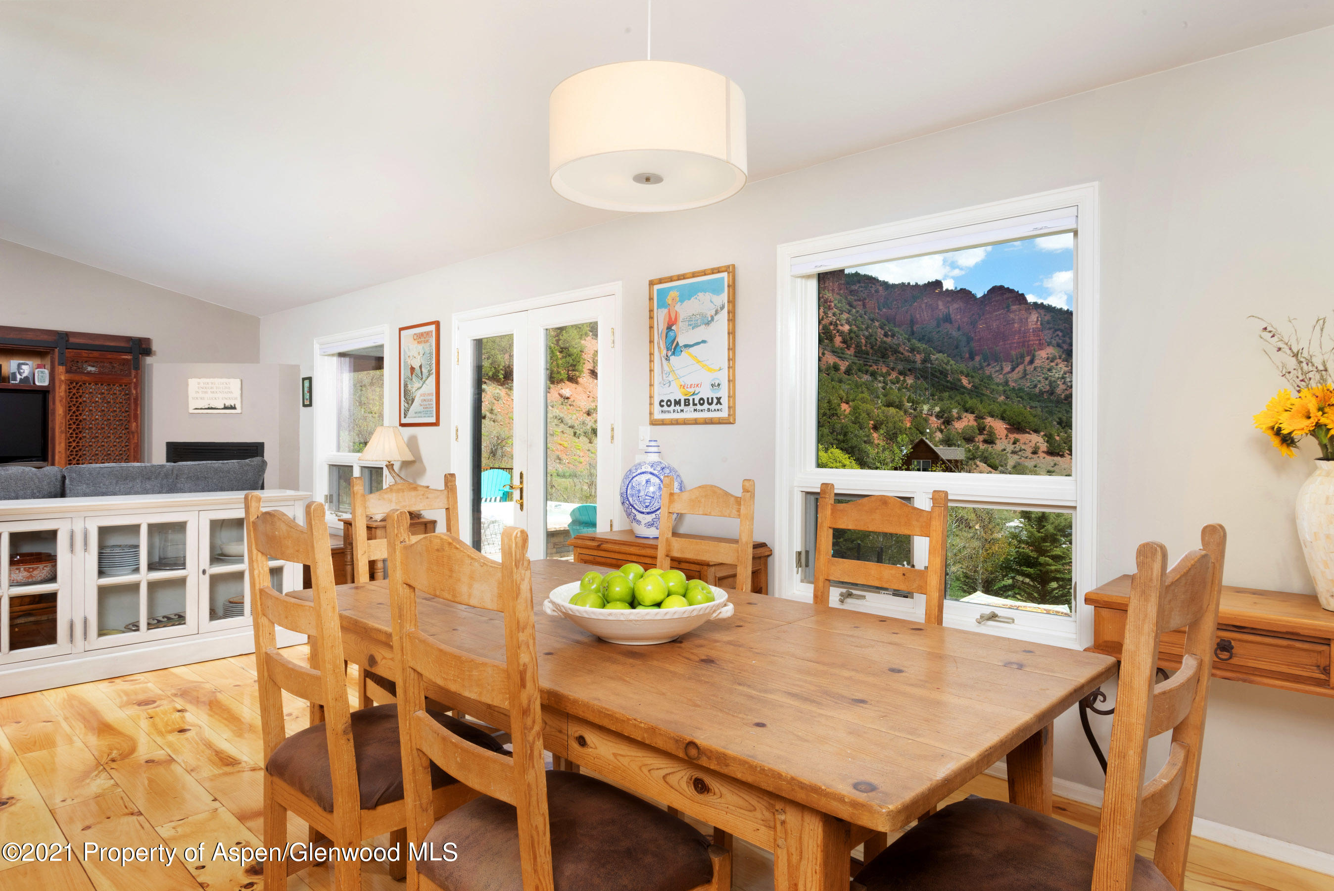 4559 Frying Pan Road Basalt, CO 81621 - Photo 11 of 35 a view of a dining room with furniture a rug and wooden floor