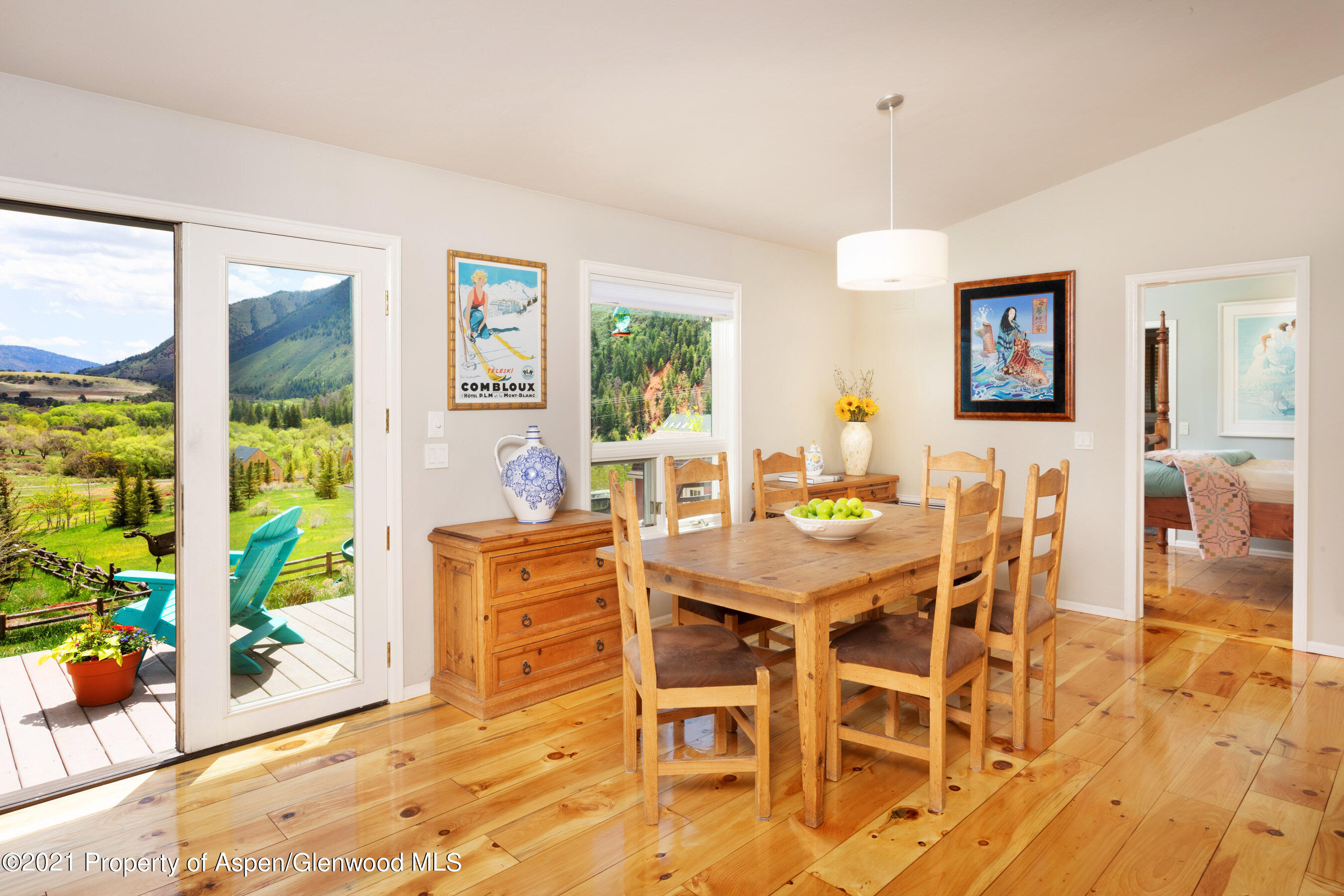4559 Frying Pan Road Basalt, CO 81621 - Photo 12 of 35 a view of a dining room with furniture window and wooden floor