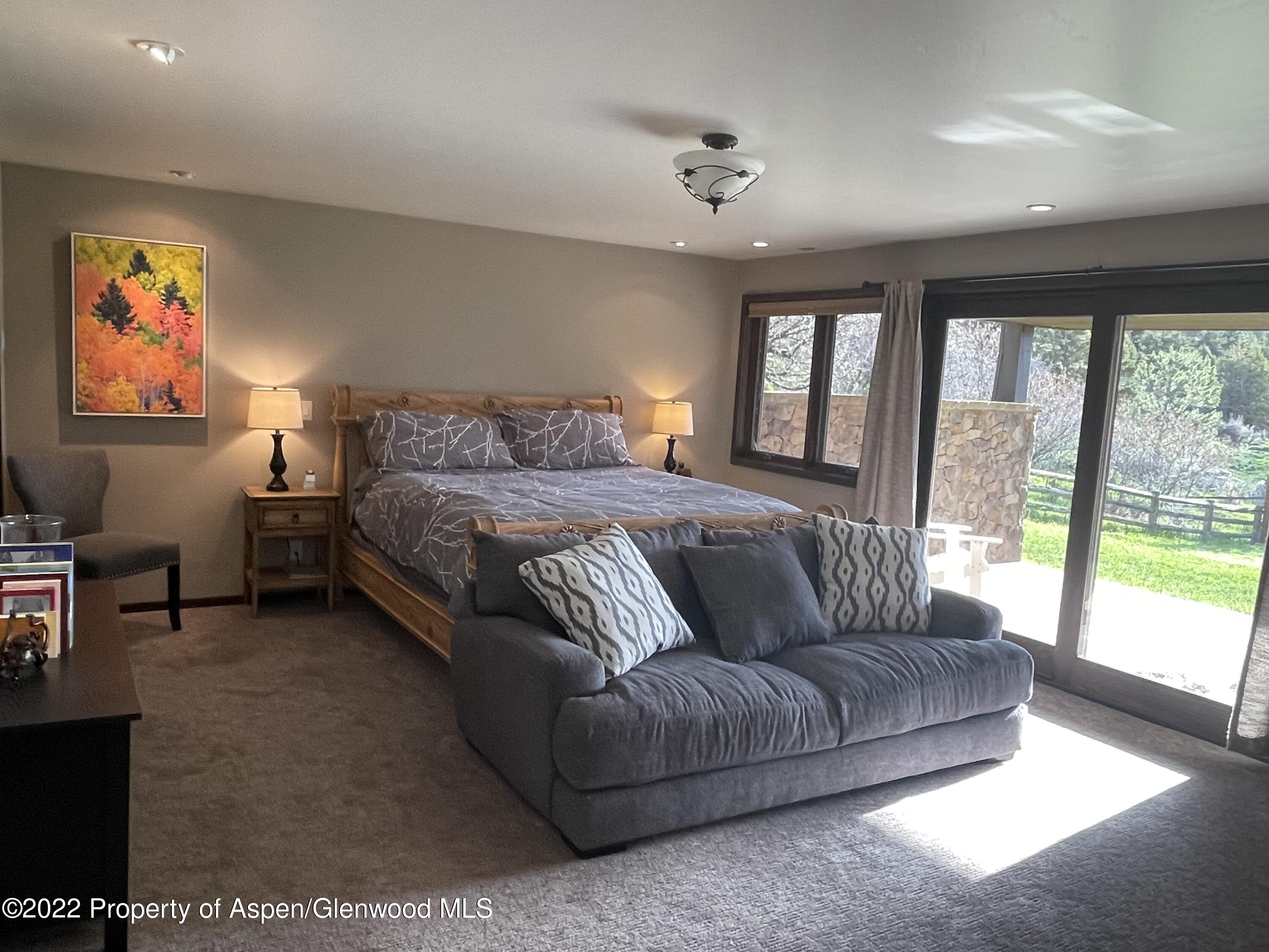4559 Frying Pan Road Basalt, CO 81621 - Photo 23 of 35 a bedroom with a bed couch and window