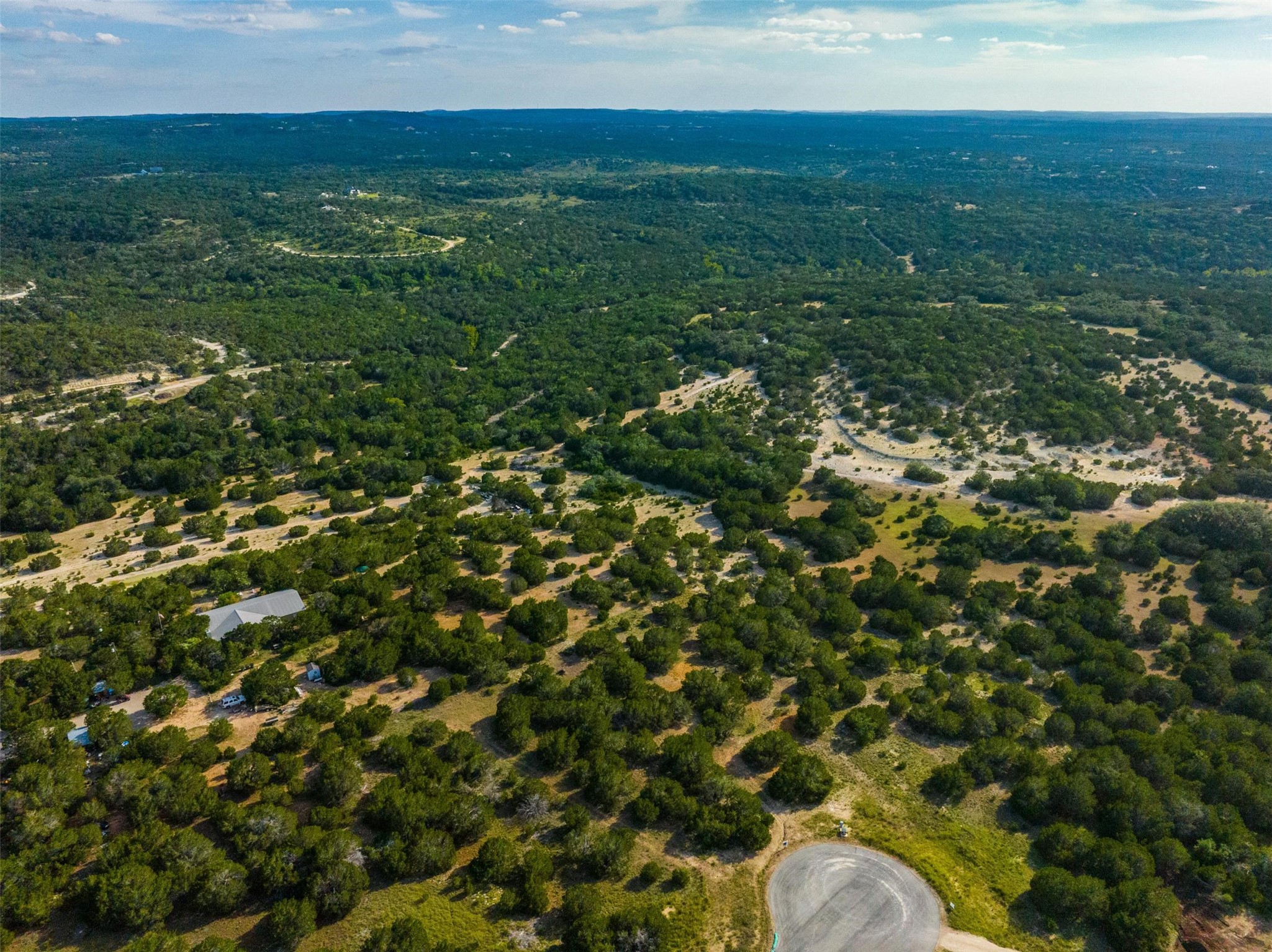 559 Vail River Road Dripping Springs, TX 78620 - Photo 12 of 19 a view of a field of grass and trees