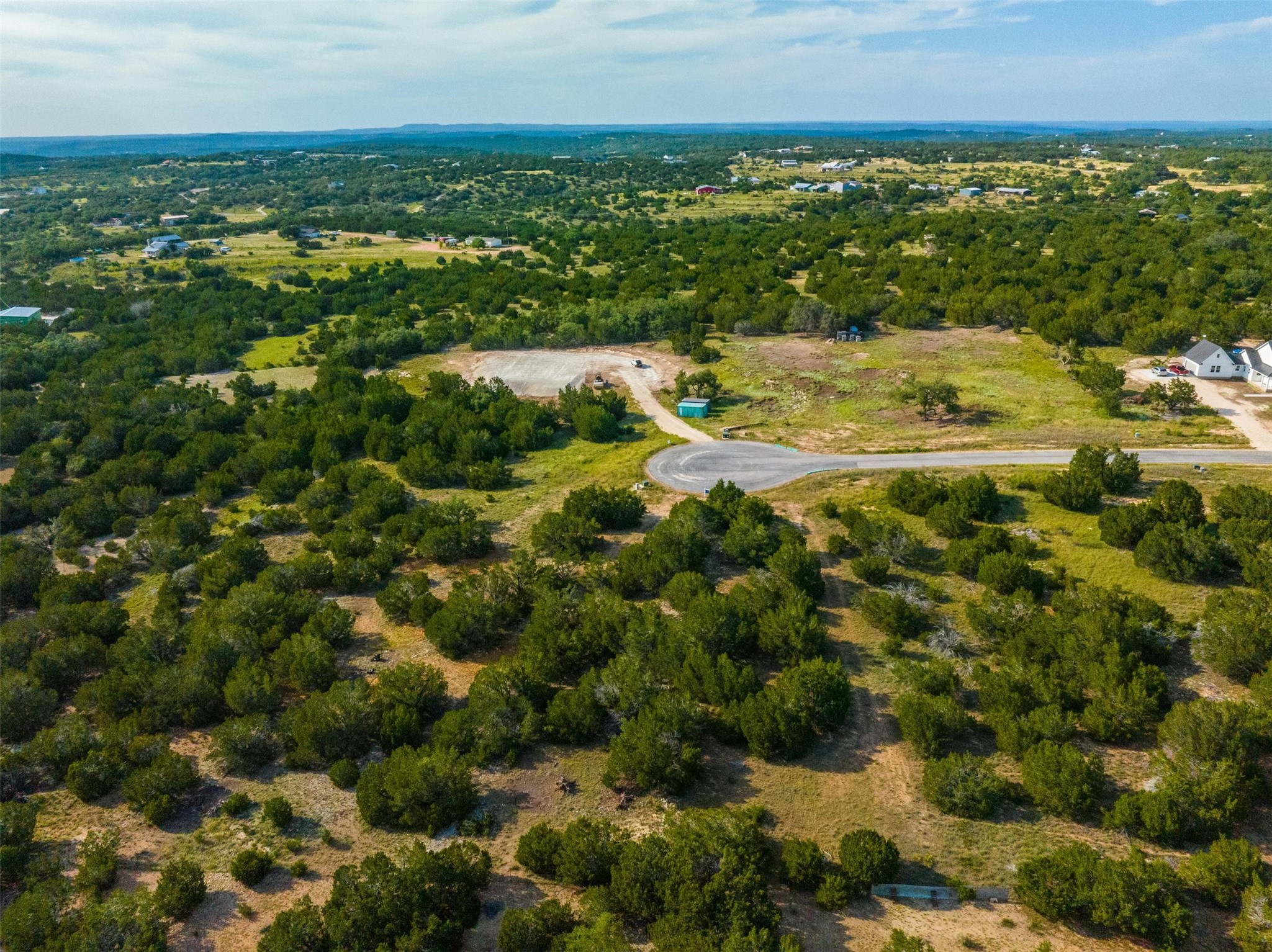 559 Vail River Road Dripping Springs, TX 78620 - Photo 17 of 19 a view of a bunch of trees and houses