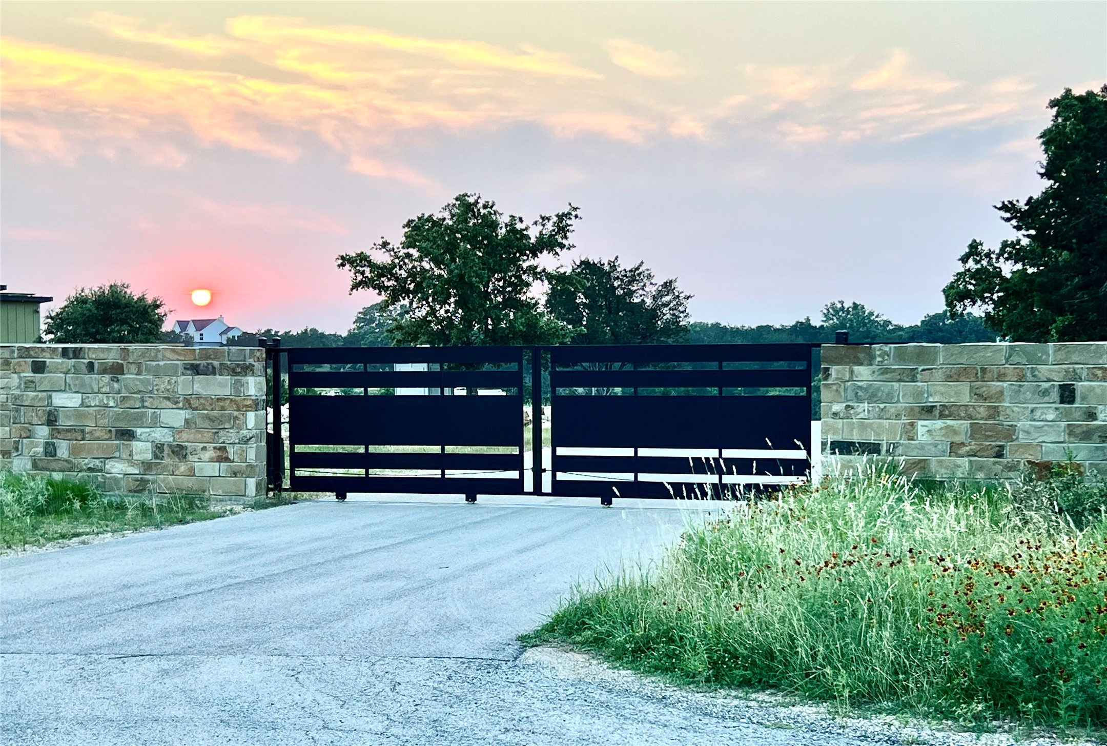 559 Vail River Road Dripping Springs, TX 78620 - Photo 2 of 19 a view of park benches sitting below a big yard
