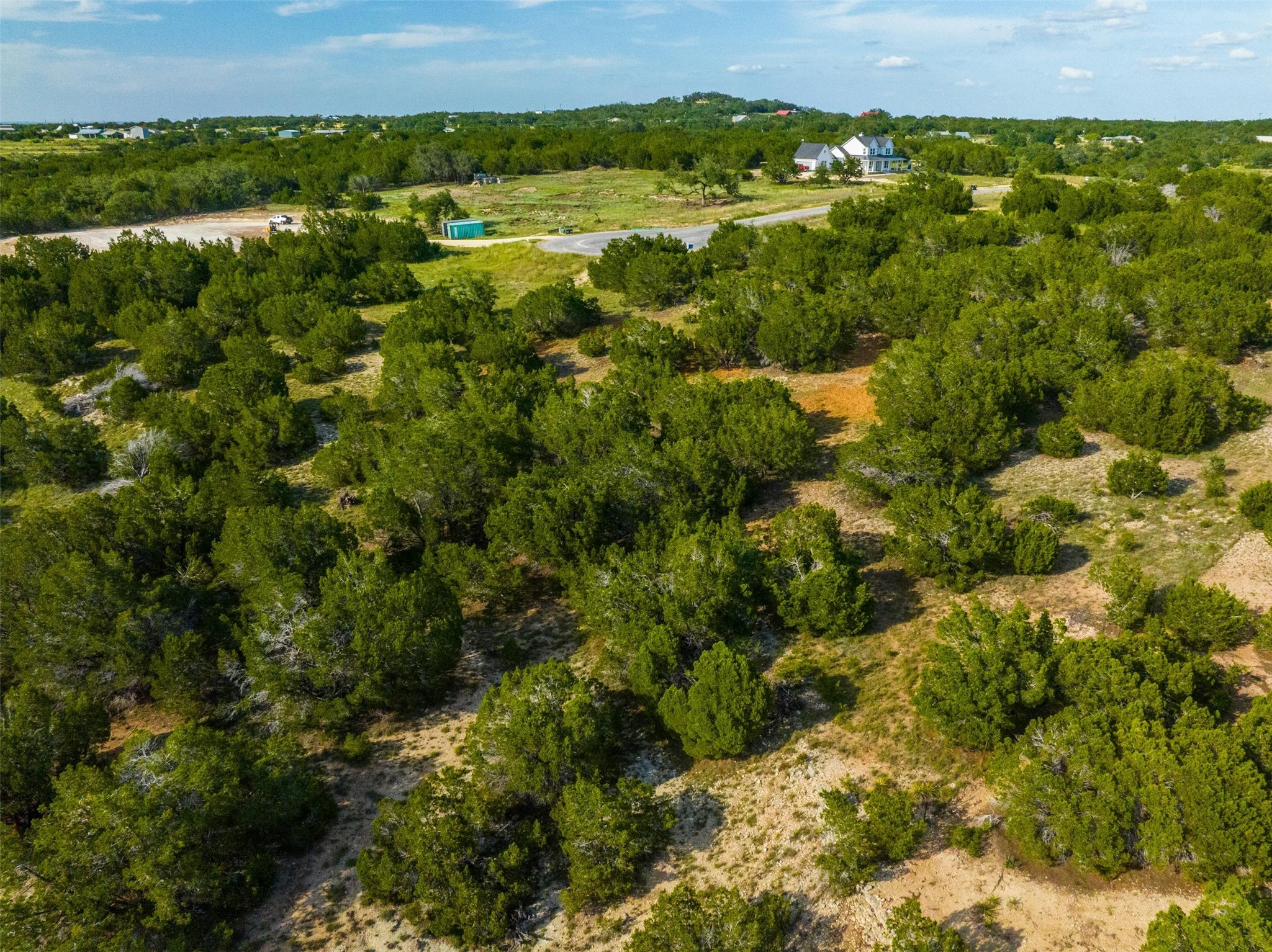 559 Vail River Road Dripping Springs, TX 78620 - Photo 3 of 19 a view of a lake with houses