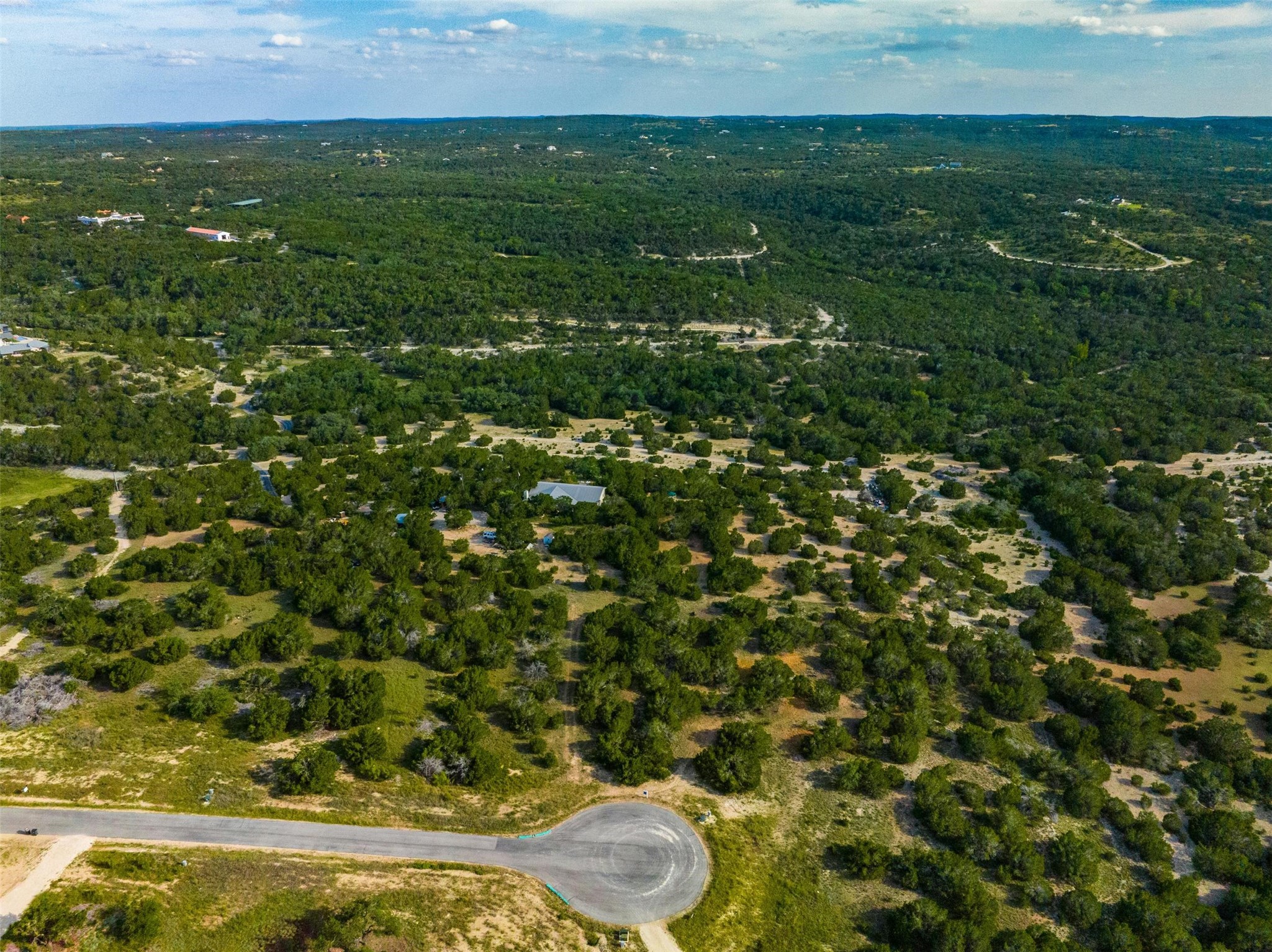 559 Vail River Road Dripping Springs, TX 78620 - Photo 7 of 19 a view of an outdoor space and a yard