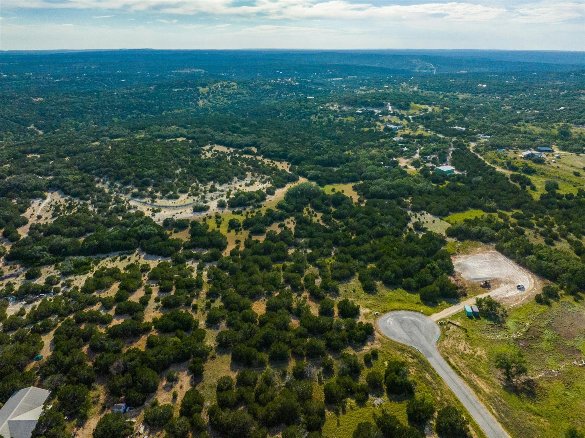 559 Vail River Road Dripping Springs, TX 78620 - Photo 9 of 19 an aerial view of residential houses with outdoor space and trees
