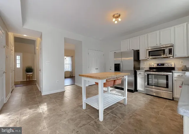a view of a two chairs in the balcony