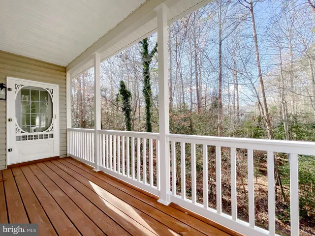 a bathroom with a bathtub and a window