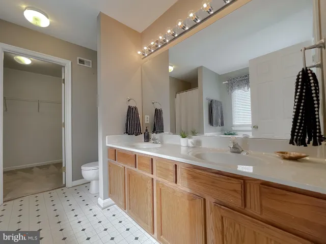 a kitchen with stainless steel appliances a refrigerator sink and microwave