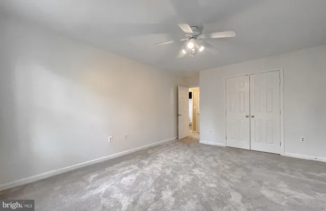 a view of room with wooden floor and flat screen tv