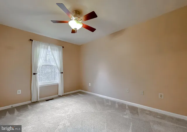 a view of a hallway with washer and dryer