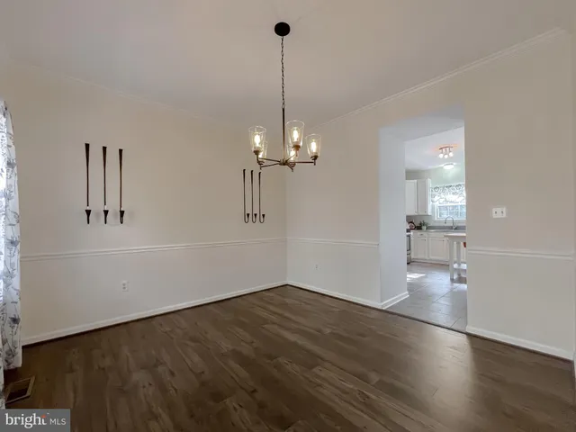 a kitchen with stainless steel appliances a stove a sink and a refrigerator