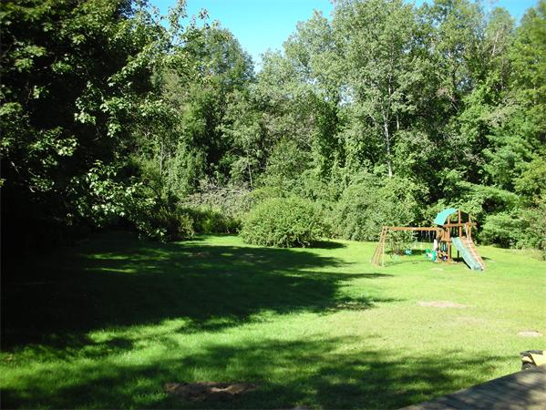 95 Brookfield Road Charlton, MA 01507 - Photo 4 of 15 a view of a golf course with a lake