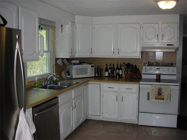 95 Brookfield Road Charlton, MA 01507 - Photo 5 of 15 a kitchen with white cabinets and sink