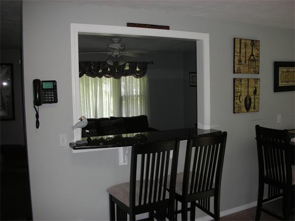 95 Brookfield Road Charlton, MA 01507 - Photo 8 of 15 a view of a hallway with furniture and windows