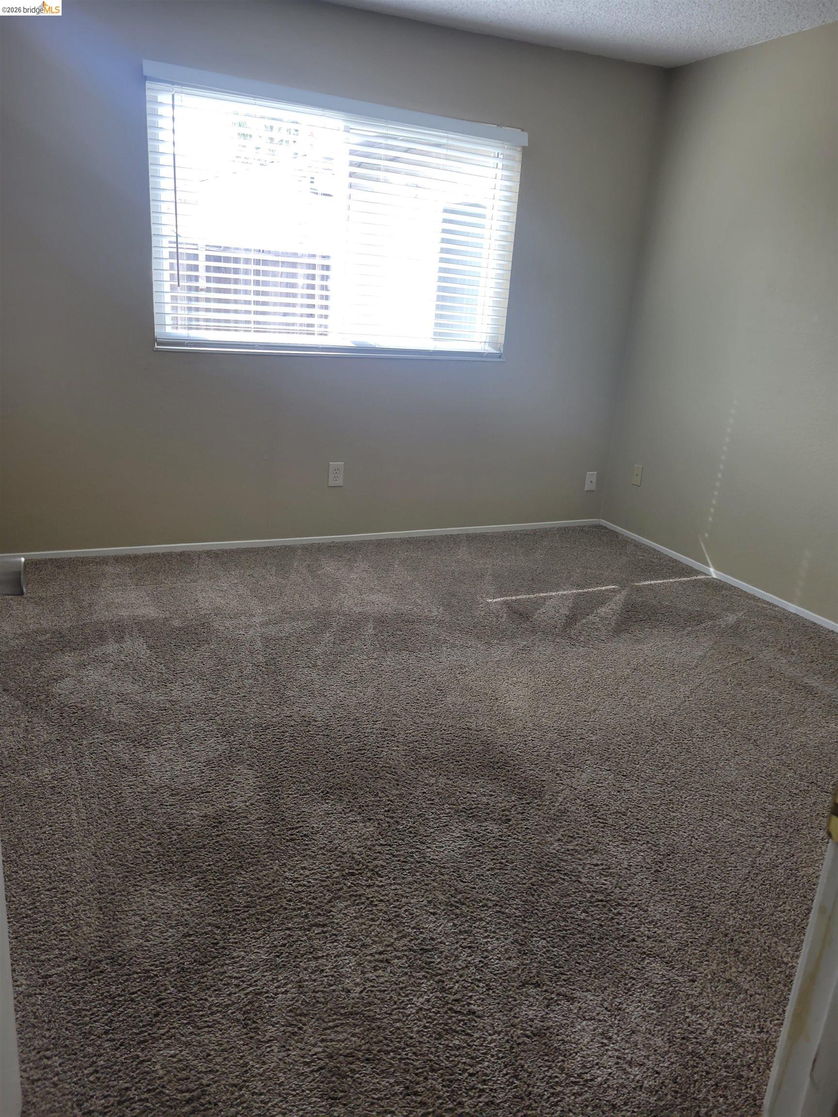 906 Coral Drive Rodeo, CA 94572 - Photo 9 of 21 an empty room with a window