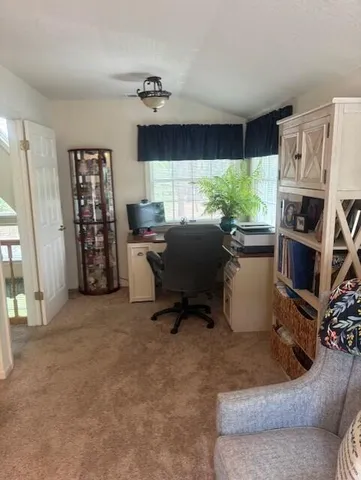 a workspace with furniture and a window