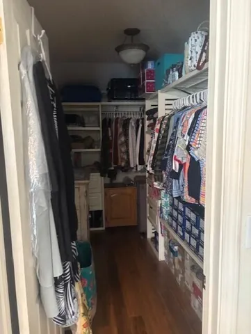 a bedroom with bed and window