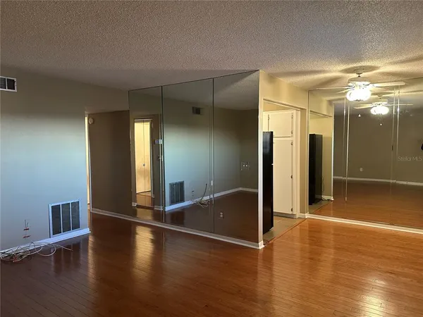 a kitchen with appliances a sink and cabinets