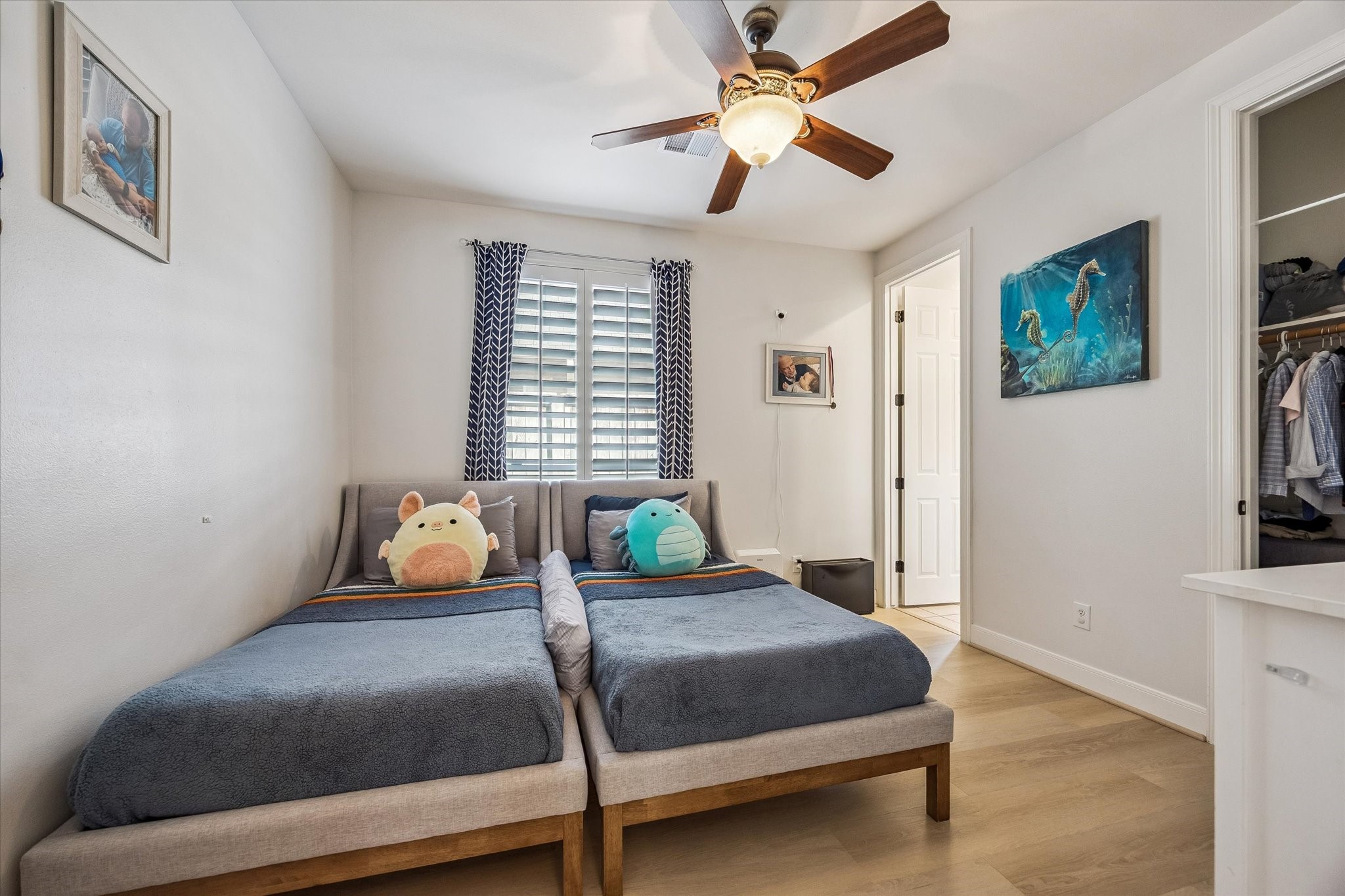 3047 Bonnebridge Way Boulevard Houston, TX 77082 - Photo 39 of 50 This highly sought-after main-floor secondary bedroom features an ensuite bathroom, elegant plantation shutters, wood flooring and a spacious closet.