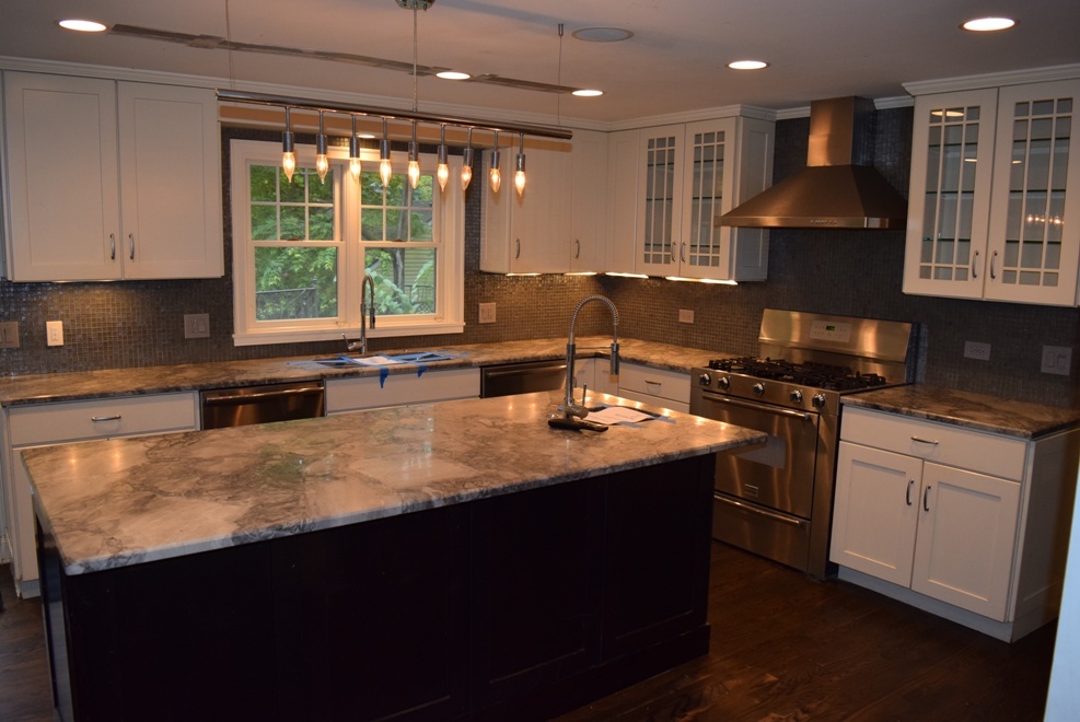 341 Scottswood Road Riverside, IL 60546 - Photo 11 of 46 a kitchen with stainless steel appliances granite countertop a sink a stove and a microwave