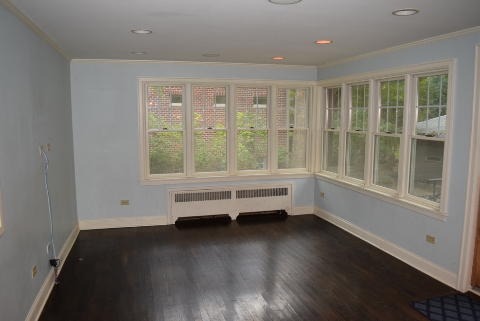341 Scottswood Road Riverside, IL 60546 - Photo 12 of 46 an empty room with wooden floor and windows