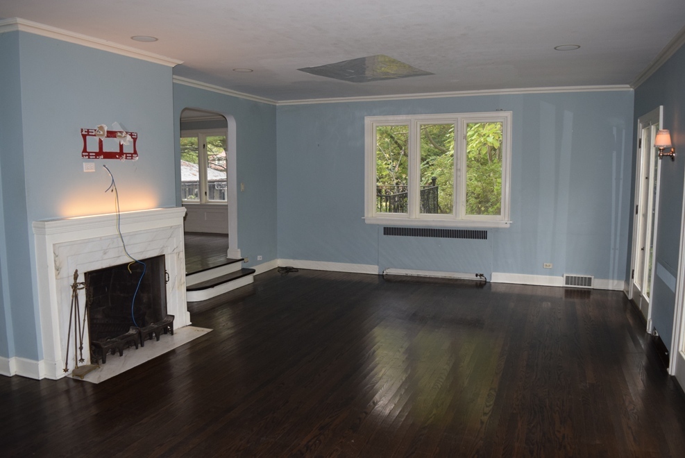 341 Scottswood Road Riverside, IL 60546 - Photo 16 of 46 a view of an empty room with wooden floor and a window