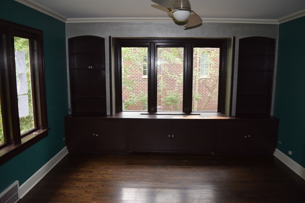 341 Scottswood Road Riverside, IL 60546 - Photo 20 of 46 a view of an empty room with wooden floor and a window