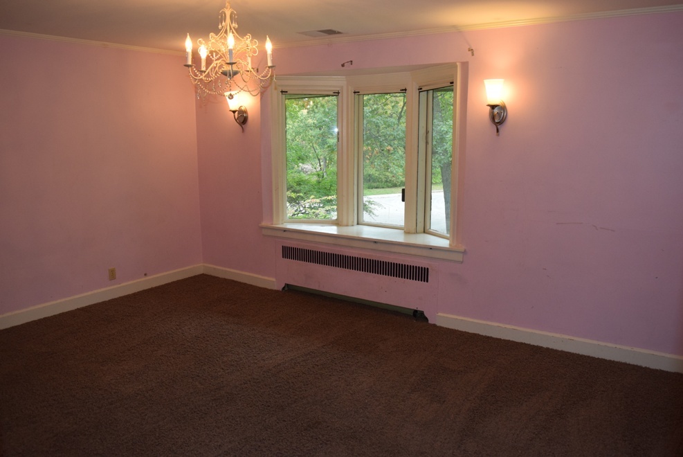 341 Scottswood Road Riverside, IL 60546 - Photo 23 of 46 a view of a room that has a window and a fireplace
