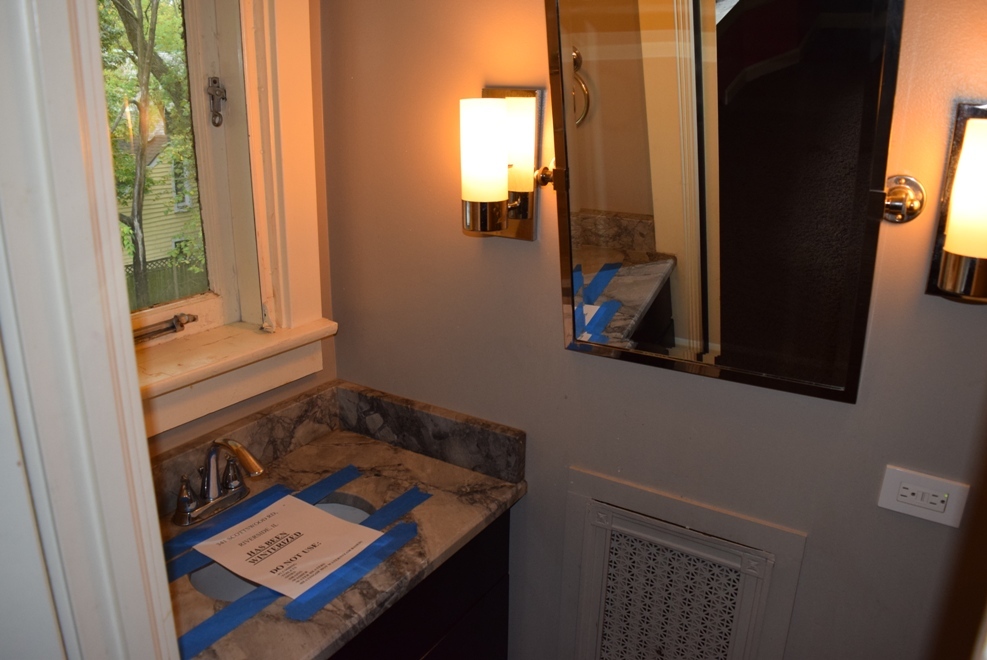 341 Scottswood Road Riverside, IL 60546 - Photo 30 of 46 a bathroom with a sink and a mirror