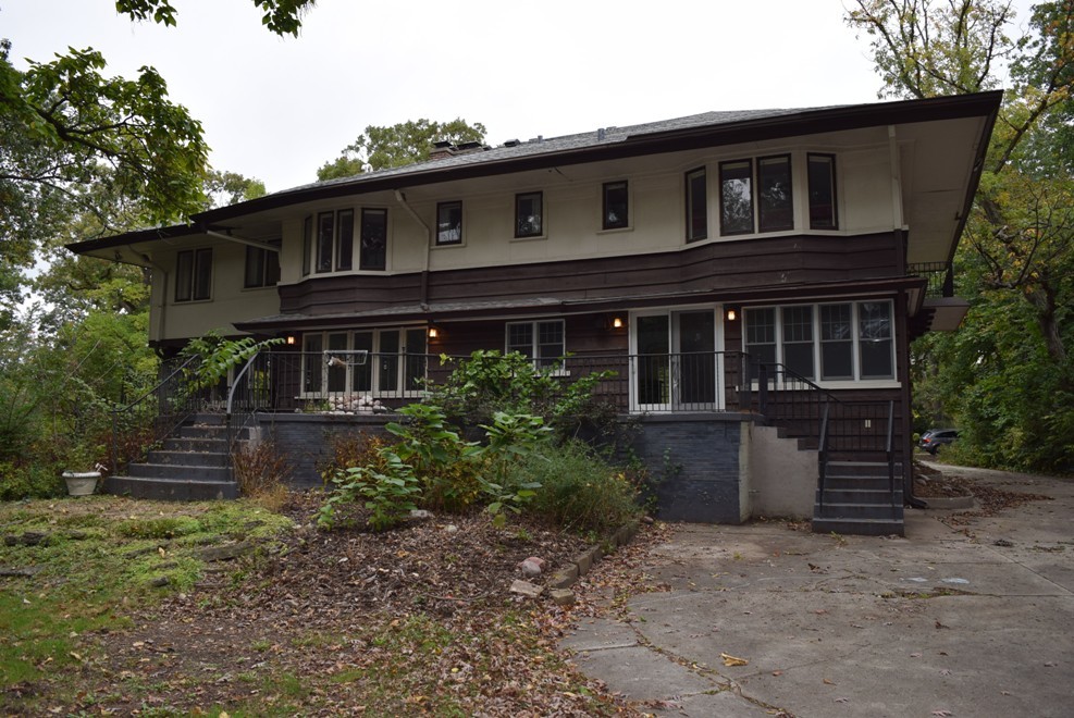 341 Scottswood Road Riverside, IL 60546 - Photo 4 of 46 a front view of a house with a garden