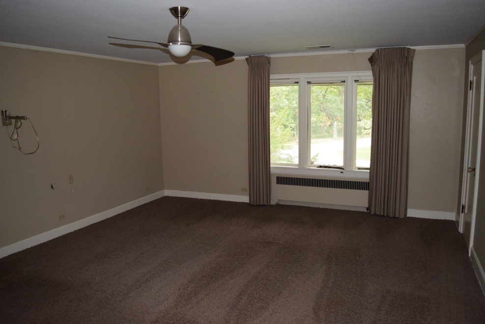 341 Scottswood Road Riverside, IL 60546 - Photo 34 of 46 a view of an empty room with a window