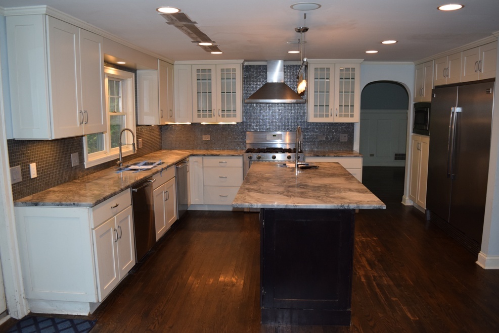 341 Scottswood Road Riverside, IL 60546 - Photo 10 of 46 a kitchen with kitchen island granite countertop a sink a center island stainless steel appliances and cabinets