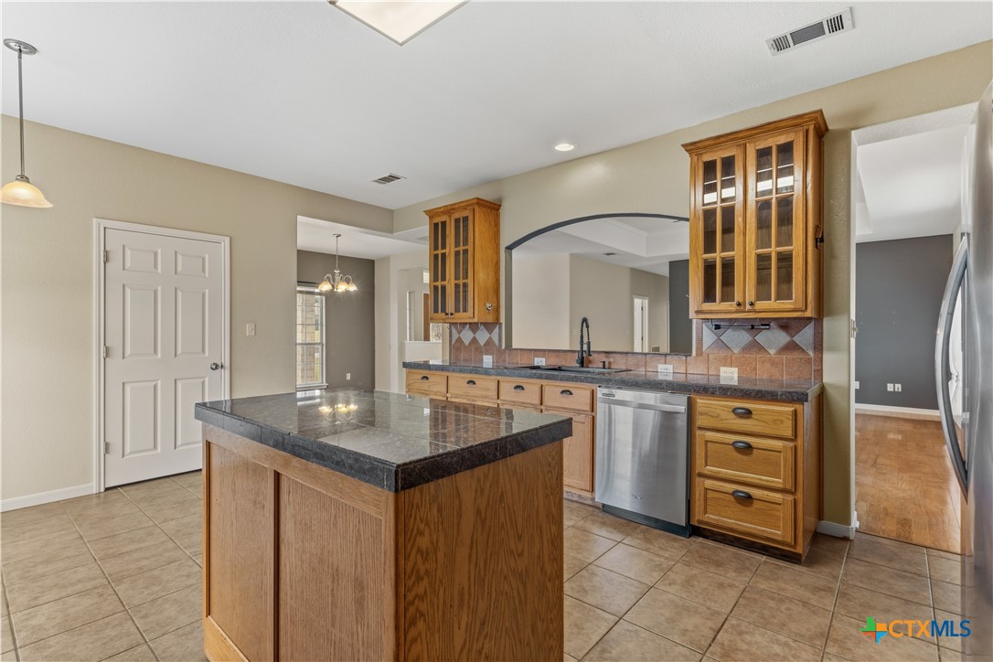 283 County Road 4710 Kempner, TX 76539 - Photo 16 of 47 a kitchen with a sink stove and cabinets