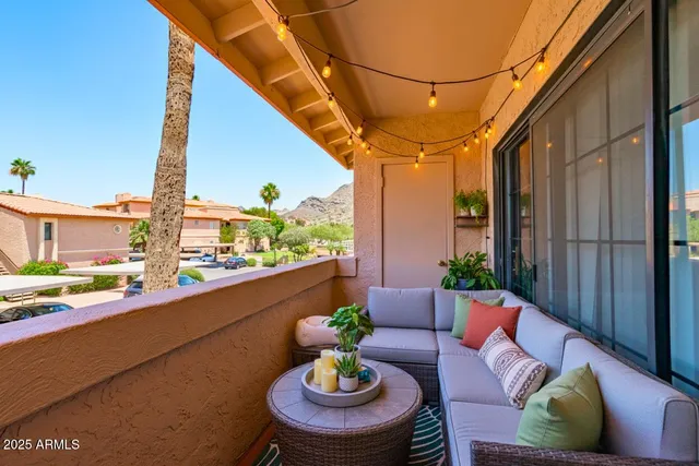 a outdoor living space with furniture and a potted plant