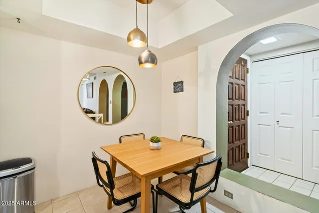 a dining room with table and hallway