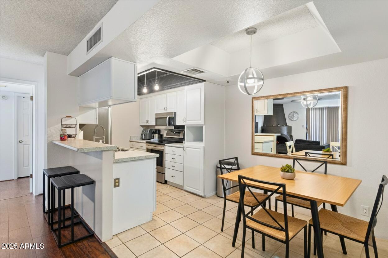10410 North Cave Creek Road, Unit 2229 Phoenix, AZ 85020 - Photo 9 of 28 Dining to Kitchen