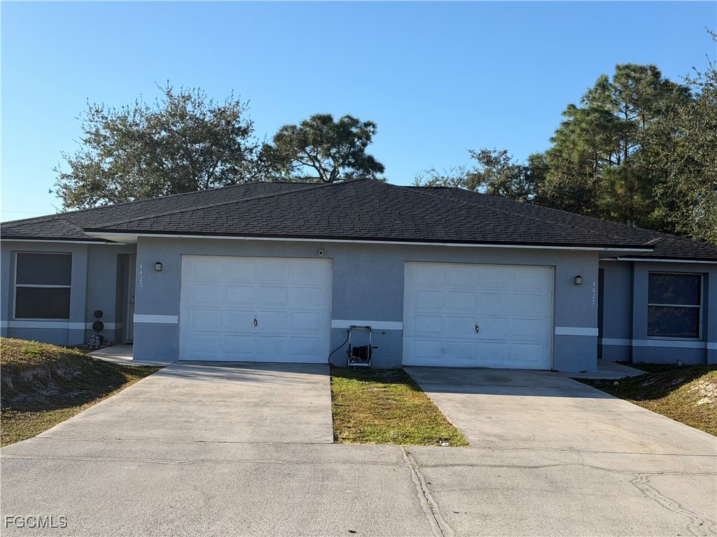 4427 25th Street Southwest Lehigh Acres, FL 33973 - Photo 1 of 20 a view of a garage
