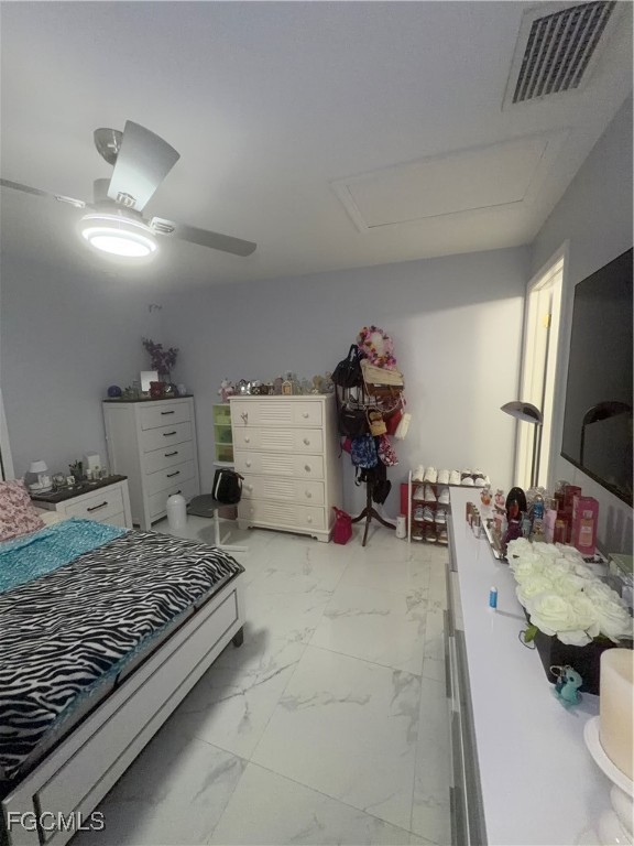 4427 25th Street Southwest Lehigh Acres, FL 33973 - Photo 14 of 20 a bed room with a bed and a television